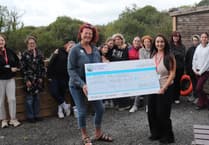 Merched y Môr present £18,000 to Action for Children at Pendine