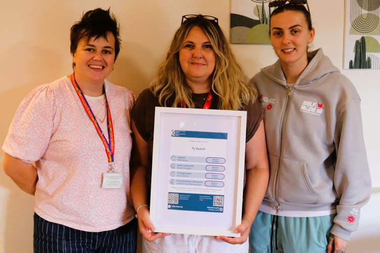 Ty Hydref - Children's Service Manager Charlotte Phillips, Registered Manager Lisa Mansell and Team Leader Darcie Escott with the CIW certificate