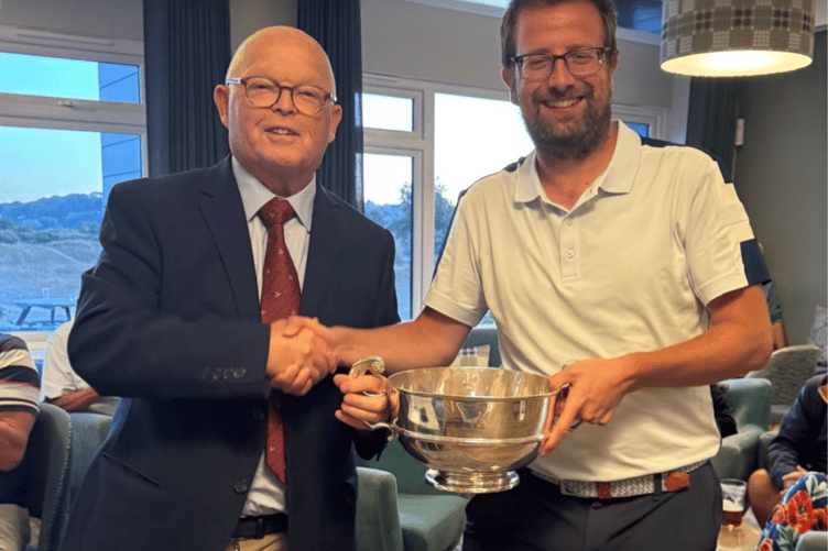 Adam Thorne receives the Regimental Bowl from Brian Jones, Tenby Golf Club Captain