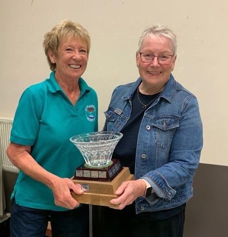 Outgoing Neyland Ladies Choir chairlady Debbie Phillips, presenting the Waterford Crystal Rosebowl to new chairlady Noreen Hadfield