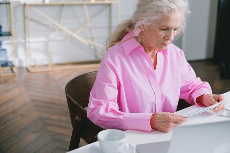 Old lady reading document