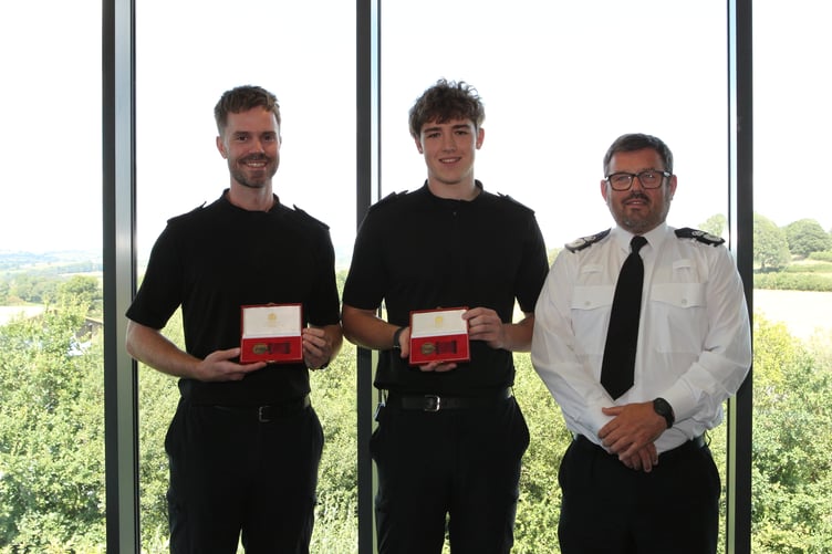 PC Taylor Rees and PC Guto Dafydd from Carmarthenshire receive bronze bravery medals for their courageous actions during a fire rescue on Mansel Street.