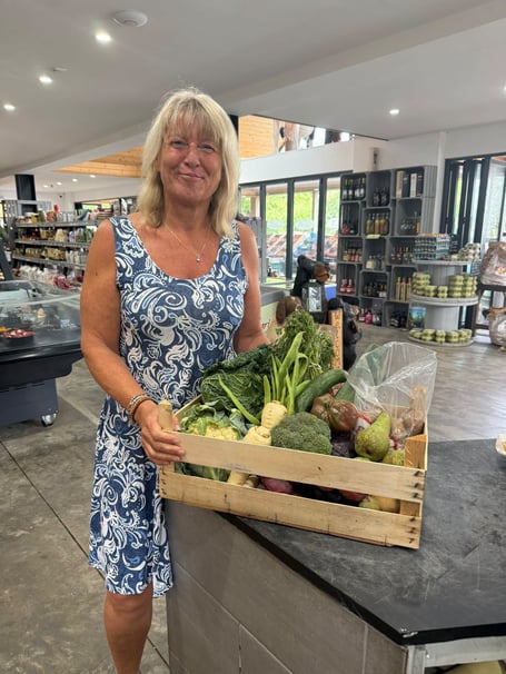Veg box competition winner Marga Cross collecting her prize from Four Seasons last Monday. The family-run florist, greengrocer and deli at Bethesda Cross, Saundersfoot ran the competition for the Bank Holiday.