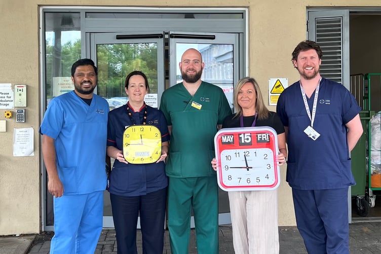 Staff from A&E with dementia clocks (Dominic Paul, Nerys Lewis, John Mackrell, Emma Green and Aled Thomas)
