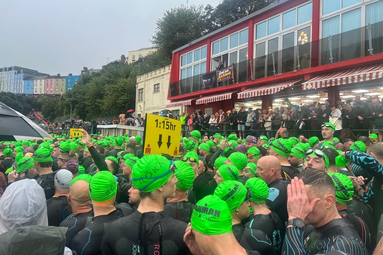 Ironman Wales 2026 competitors at the swim start on Tenby's North Beach