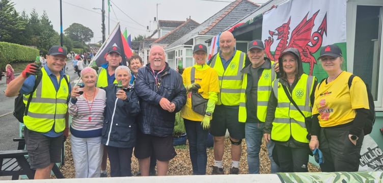 Members and friends of Saundersfoot Rotary are pictured with supporters of the event on Broadfield Hill, Saundersfoot during the Ironman Wales event.