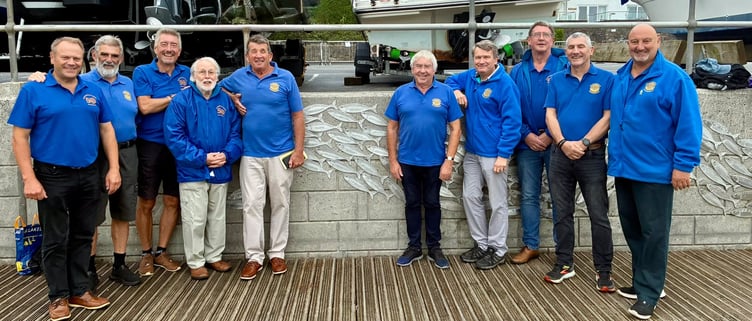 The Saundersfoot Rotary Club has revealed a commemorative fish plaque at the harbour, celebrating its 50th anniversary and honouring the commitment of its members.