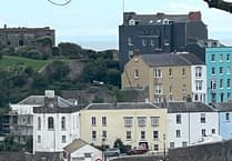 Crane tips over at Tenby Harbour pier