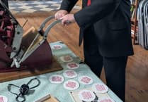 Councillor Thomas Tudor tries printmaking in Haverfordwest
