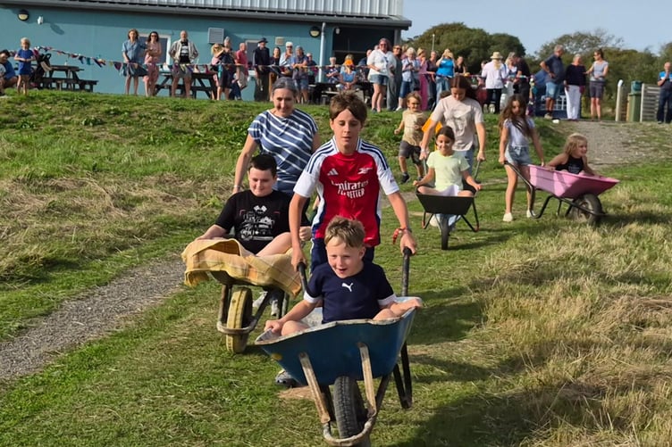 Wheelbarrow racing fun at Giraldus Centre during the Manorbier and District Village Show 2026
