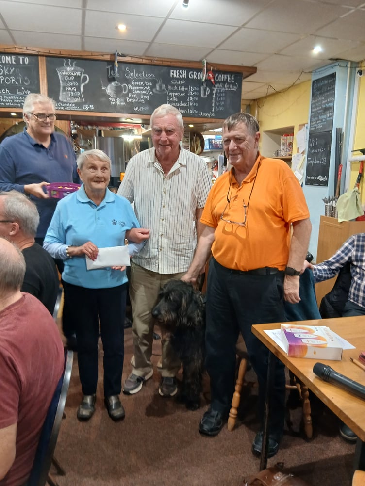 Eva Rich and Guide Dogs Cymru fundraisers receiving a donation at the Templebar Inn, Amroth