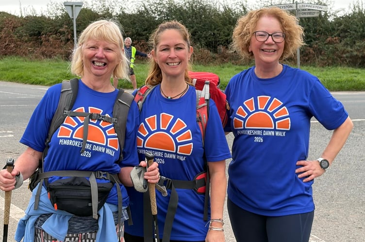 Three dawn walkers - and a marshall just visible behind them