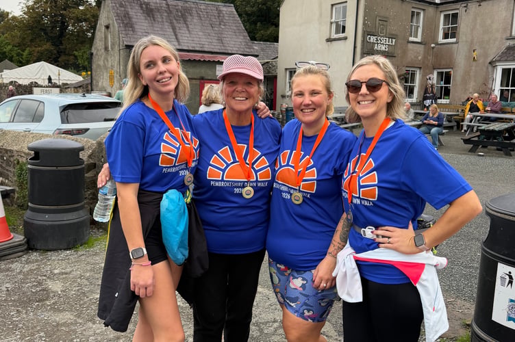 Pembrokeshire Dawn Walk 2026 - four walkers at Cresselly Arms
