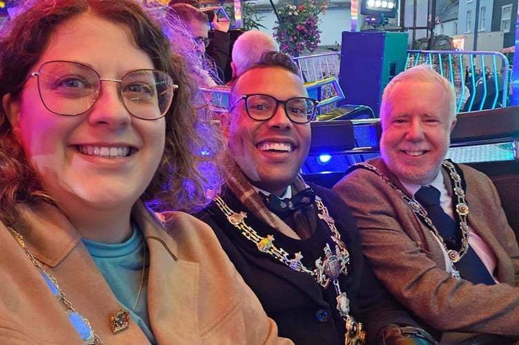 Mayor Randell Thomas-Turner (centre) described the opening of the St Michaelmas Fair in Pembroke as a "brilliant evening".