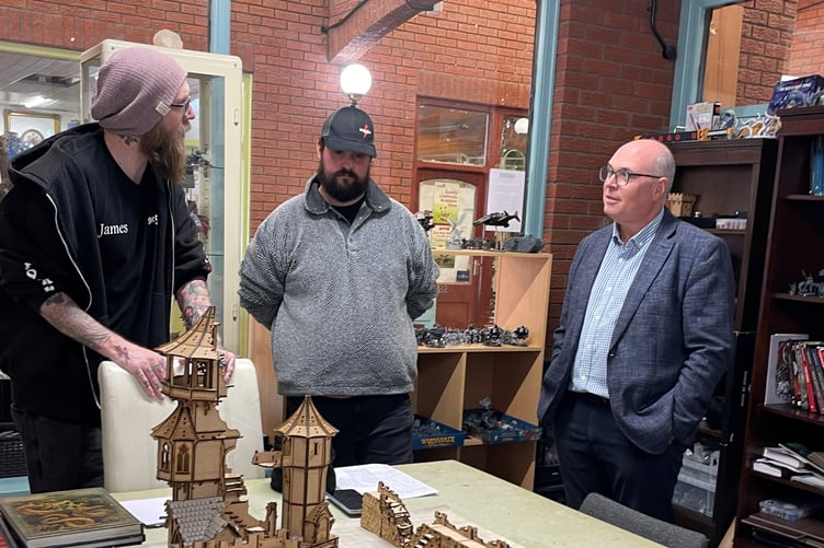 Paul Davies MS with James Densham and a volunteer at Stormborn Games
