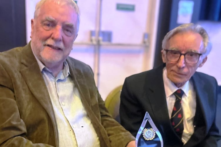 Terry Evans and President Blake Shaw with the award
