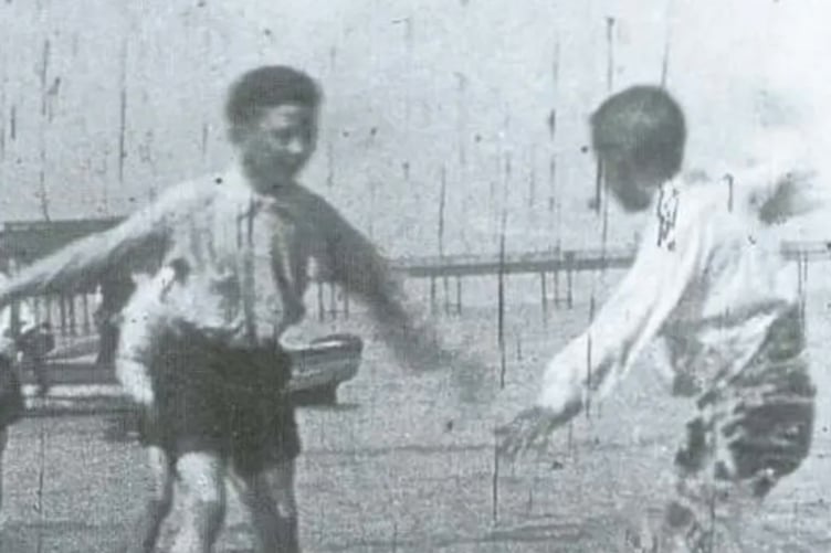 Children on the Beach (1898) - pioneering film footage captured on Rhyl Sands by Arthur Cheetham. This early example of Welsh filmmaking features in Theatr Gwaun's inaugural Welsh Film Festival, celebrating 130 years of cinema in Wales from 23–25 October 2026.
Image credit: Arthur Cheetham (1898).