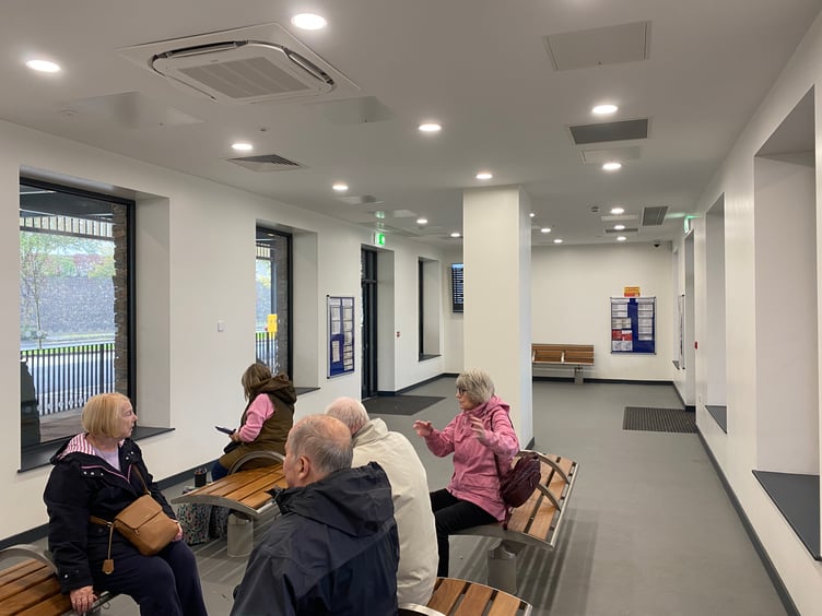 Haverfordwest Transport Interchange: people using the waiting room.