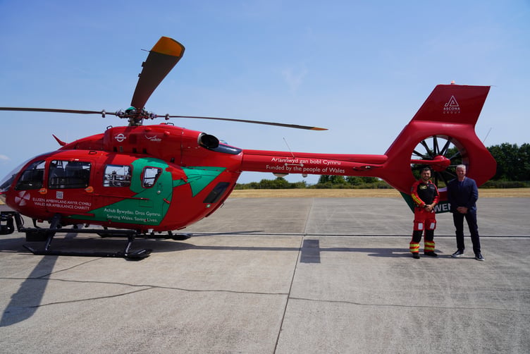 Darren Briggs, Ascona Group CEO, pictured right with a Wales Air Ambulance crew member