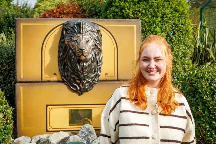 Katie with her bronze memorial to Hugo, at the Folly Farm unveiling on October 19