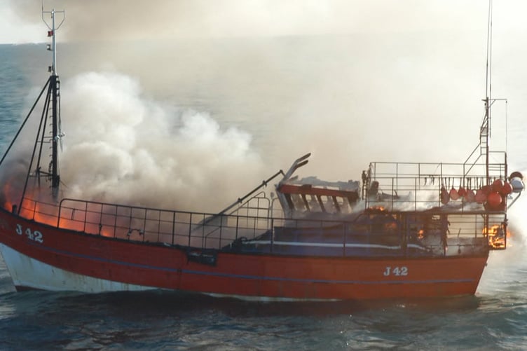 At night, in gale force winds and very rough seas, on 21 December 2004 Yves Marie Amil, a fishing trawler was ablaze and disabled. St Davids RNLI volunteers went to their assistance, managing to position the lifeboat alongside the trawler in gale force winds and 3-4m breaking waves, saving the lives of three fishermen aboard the vessel.