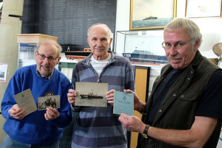 Pictured from left to right are John Evans of the Heritage Trust team with brothers Christopher and Michael Stone, displaying some of the archive items.