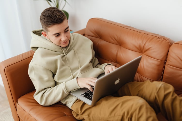 A boy using a laptop