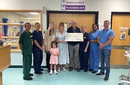 Pictured above: Photo 1: Lisa, Diana, Geoff (Sonia’s husband) Huw, and Lottie with staff from Ward 9.