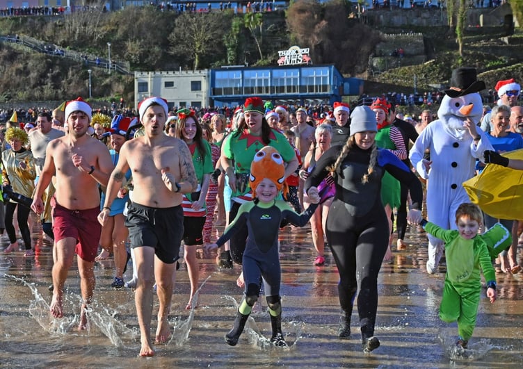 The 2026 Tenby Boxing Day Swim will have an 'all things seaside' fancy dress theme (Photo by Gareth Davies Photography)