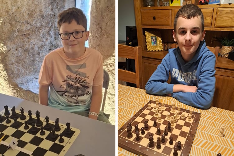 Young Harry Harling, Owain Hooper, each with a chess board