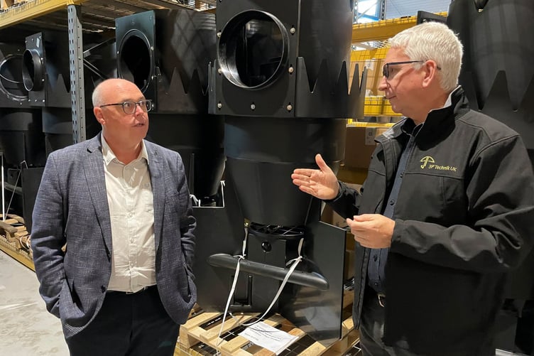 Paul Davies visiting a Ceredigion business, talking with team member