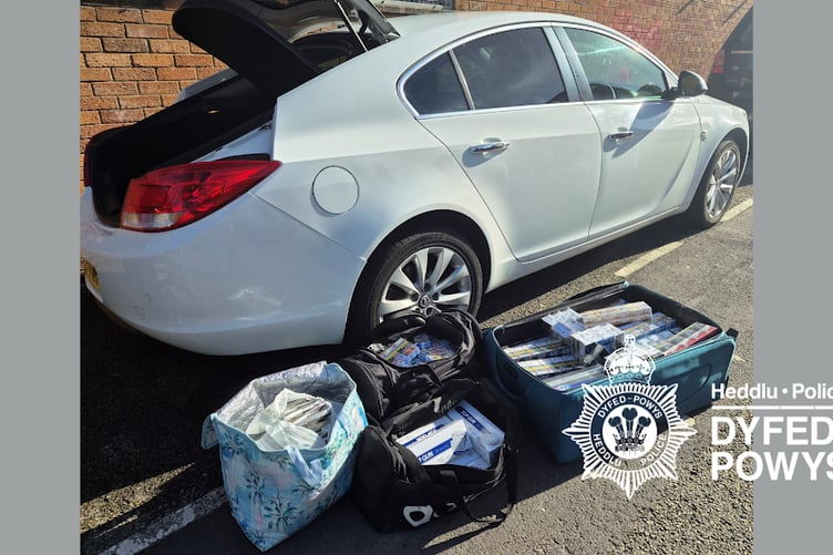 A multi-agency operation in Carmarthenshire has resulted in the seizure of thousands of illegal cigarettes and the arrest of several people